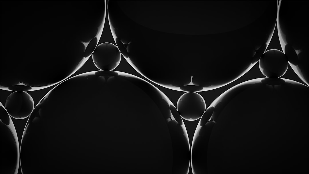 a-black-and-white-photo-of-some-circles-dqb5kssqb1i